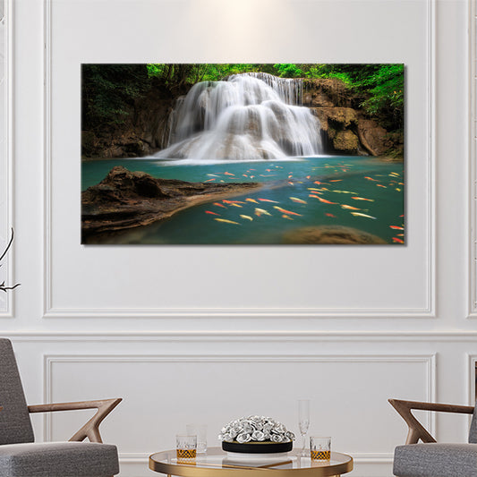 Beautiful waterfall with golden goldfish