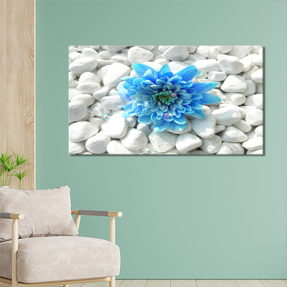 Blue flower on white pebbles